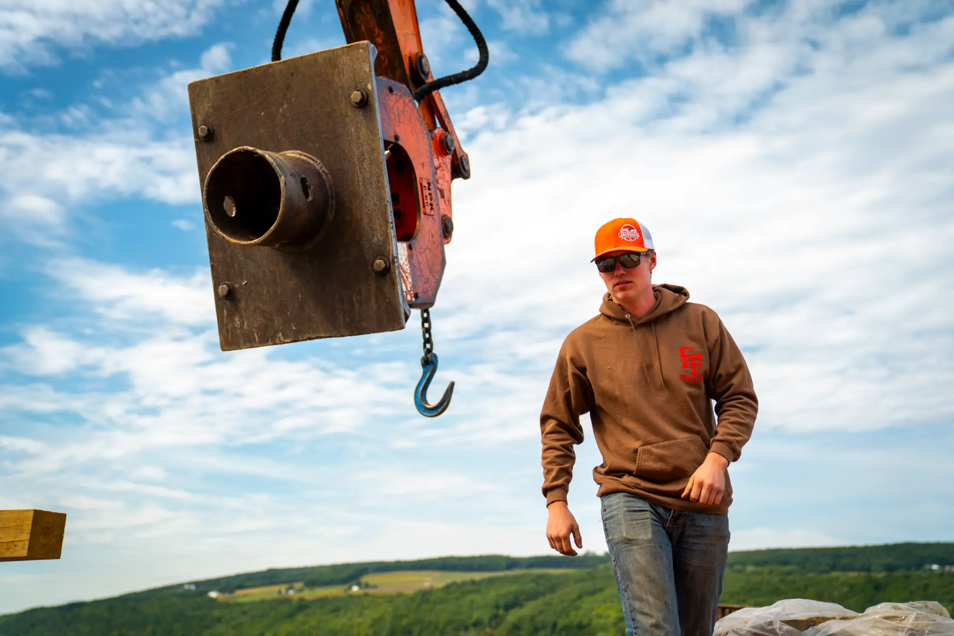 Superior crew member working beside marine equipment