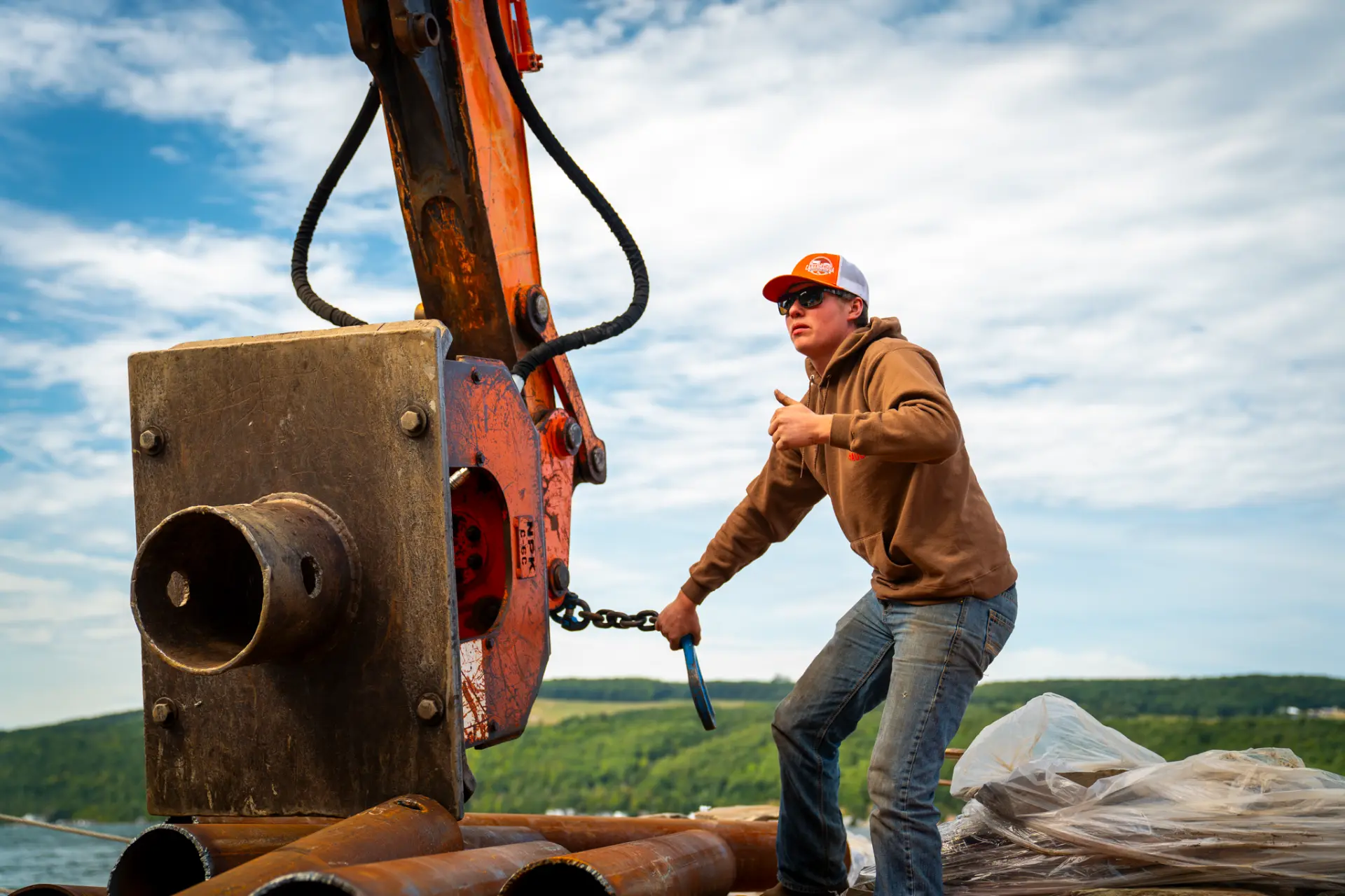 Crew member directing crane operations